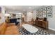 Open-concept living room connected to a modern kitchen and stylish furnishings at 3040 S Dexter Way, Denver, CO 80222