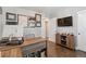 Spacious home office with natural light, wood floors, and ample desk space at 3040 S Dexter Way, Denver, CO 80222