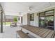 Spacious covered patio with an outdoor dining table and bench at 3040 S Dexter Way, Denver, CO 80222