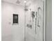Bright walk-in shower with a rainfall showerhead, handheld sprayer, and built-in niche at 3040 S Dexter Way, Denver, CO 80222