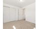 Clean bedroom with closet and doorway bathed in natural light at 10699 W 9Th Pl, Lakewood, CO 80215