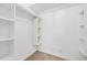 Walk-in closet with built in shelving and plenty of storage space at 10699 W 9Th Pl, Lakewood, CO 80215