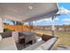 Cozy covered patio featuring a seating area and unobstructed views of the city at 10699 W 9Th Pl, Lakewood, CO 80215