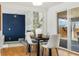 Bright dining room features hardwood floors, modern fireplace, and sliding glass doors at 10699 W 9Th Pl, Lakewood, CO 80215