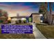 Charming single-Gathering home featuring a well-maintained lawn and a welcoming green front door at 10699 W 9Th Pl, Lakewood, CO 80215