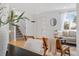 Bright, inviting living room with stylish decor, hardwood floors, and a staircase at 10699 W 9Th Pl, Lakewood, CO 80215