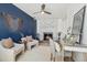 This sitting room features a fireplace, desk area, and lots of natural light at 10699 W 9Th Pl, Lakewood, CO 80215