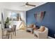 Cozy room is styled with a small tent, two chairs, and ample natural light at 10699 W 9Th Pl, Lakewood, CO 80215