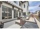 Comfortable outdoor living space on the patio, featuring a seating area and gas grill at 2640 S Orchard St, Lakewood, CO 80228