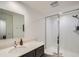 Well-lit bathroom with a glass-enclosed shower and a modern vanity with sleek fixtures at 2640 S Orchard St, Lakewood, CO 80228