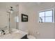 Well-lit bathroom with stylish mirror, modern fixtures, and glass-enclosed shower at 2640 S Orchard St, Lakewood, CO 80228