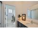 Bright bathroom featuring a modern vanity and bathtub with a stylish cactus-themed shower curtain at 2640 S Orchard St, Lakewood, CO 80228
