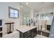 Modern bathroom featuring a sleek vanity, large mirror, and a glass-enclosed shower at 2640 S Orchard St, Lakewood, CO 80228