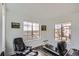 Bright bedroom featuring large windows, dark wood floors, and space for a home gym at 2640 S Orchard St, Lakewood, CO 80228