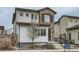Charming two-story home with a stone and siding facade, landscaped yard, and inviting entrance at 2640 S Orchard St, Lakewood, CO 80228