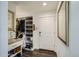 Entryway mudroom with ample storage, including shelving, cubbies, and hanging space for coats at 2640 S Orchard St, Lakewood, CO 80228