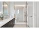 Bright bathroom featuring a modern shower, sleek vanity, and contemporary design elements at 155 Steele St # 414, Denver, CO 80206