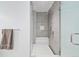 Modern bathroom featuring glass shower, tiled walls, and a convenient built-in bench at 155 Steele St # 414, Denver, CO 80206
