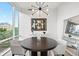 Bright dining space with contemporary lighting, stylish artwork, and city views at 155 Steele St # 414, Denver, CO 80206