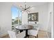 Bright dining area with designer lighting, modern artwork, and cityscape views at 155 Steele St # 414, Denver, CO 80206