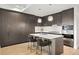 Chic kitchen featuring custom cabinets, stainless appliances, and a center island for meal preparation at 155 Steele St # 414, Denver, CO 80206