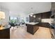 Open concept living space features modern kitchen with sleek cabinetry and an island at 155 Steele St # 414, Denver, CO 80206