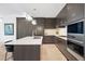 Gourmet kitchen features sleek countertops, stainless steel appliances, and ample storage space at 155 Steele St # 414, Denver, CO 80206