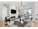 Chic living area with fireplace, comfortable seating, and a beautiful balcony at 155 Steele St # 414, Denver, CO 80206