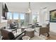Sophisticated living room showcasing stylish seating, fireplace and balcony access at 155 Steele St # 414, Denver, CO 80206