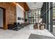 Modern lobby with a marble reception desk, wood accent wall and seating at 155 Steele St # 414, Denver, CO 80206