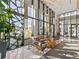 Bright lobby with modern furniture, floor-to-ceiling windows, and decorative lighting at 155 Steele St # 414, Denver, CO 80206