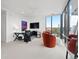 Bright office space with large windows, modern furniture, and stylish decor; perfect work from home setup at 155 Steele St # 414, Denver, CO 80206