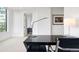 Well-lit office space with a modern desk setup and a view to the Primary bathroom at 155 Steele St # 414, Denver, CO 80206