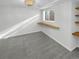 Bright, finished basement room with wood shelving at 2685 S Dayton Way # 74, Denver, CO 80231