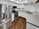 Modern kitchen with stainless steel appliances and hardwood floors at 2685 S Dayton Way # 74, Denver, CO 80231