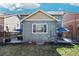 Well-kept backyard featuring patio, hot tub, and outdoor dining set, perfect for relaxing and entertaining at 12233 Hannibal St, Commerce City, CO 80603