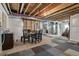 Unfinished basement featuring exposed ceiling with ductwork, and a carpet tile floor at 12233 Hannibal St, Commerce City, CO 80603