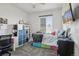 Bright bedroom with bed, desk, and cube storage, offering a cheerful space at 12233 Hannibal St, Commerce City, CO 80603