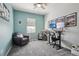 Cozy bedroom featuring a plush armchair, desk, and neutral carpeting at 12233 Hannibal St, Commerce City, CO 80603