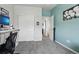 Bedroom showing a closet and doorway, neutral walls, and soft carpet at 12233 Hannibal St, Commerce City, CO 80603