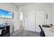 Bright bedroom featuring neutral paint, gray carpet, a TV, and closet for ample storage at 12233 Hannibal St, Commerce City, CO 80603
