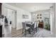 Inviting dining area with hardwood floors and bright natural light, offering great space for gathering at 12233 Hannibal St, Commerce City, CO 80603
