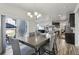 Elegant dining area connecting seamlessly to the outdoor patio and open kitchen, perfect for entertaining at 12233 Hannibal St, Commerce City, CO 80603