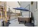 Outdoor patio featuring a hot tub and seating, creating a relaxing backyard retreat at 12233 Hannibal St, Commerce City, CO 80603