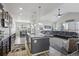 Open-concept design with an expansive kitchen, dining area, and Gathering room, perfect for modern living at 12233 Hannibal St, Commerce City, CO 80603