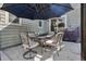 Outdoor patio with comfortable seating arrangement under a large umbrella, perfect for relaxation at 12233 Hannibal St, Commerce City, CO 80603