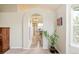 Inviting bathroom entrance with archway and view of tiled shower at 1210 Snowberry Ln, Broomfield, CO 80020