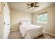 Cozy bedroom featuring a plush bed, window, and closet at 1210 Snowberry Ln, Broomfield, CO 80020