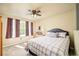 Comfortable bedroom featuring a ceiling fan and natural light at 1210 Snowberry Ln, Broomfield, CO 80020