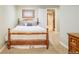Charming bedroom with wood frame bed and neutral carpet flooring at 1210 Snowberry Ln, Broomfield, CO 80020